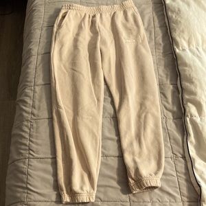 Cream colored sweat pants for kids.